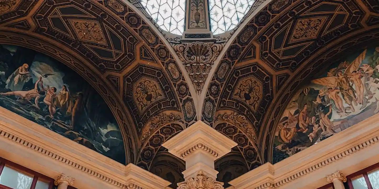 Decorative vaulted ceiling with ornate arches illustrating complex roof joints, flashing, and valleys