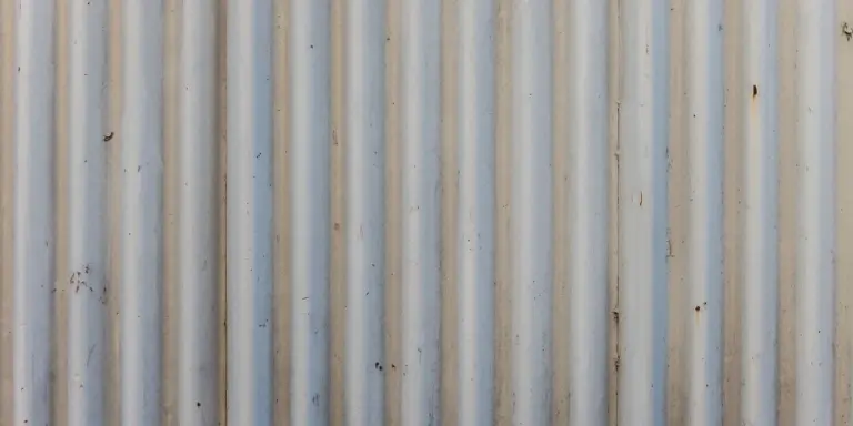 Close-up of vertical corrugated metal roof panels