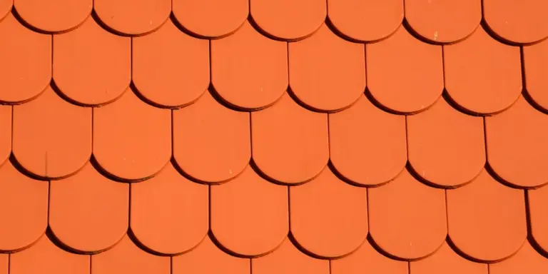 Close-up of overlapping orange roof tiles